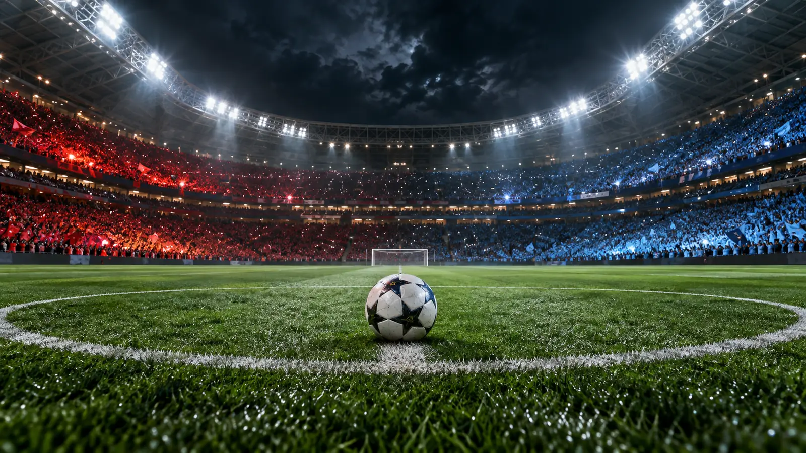 Jalgpall keskringis õhtusel staadionil, tribüünidel punased ja sinised poolehoidjad